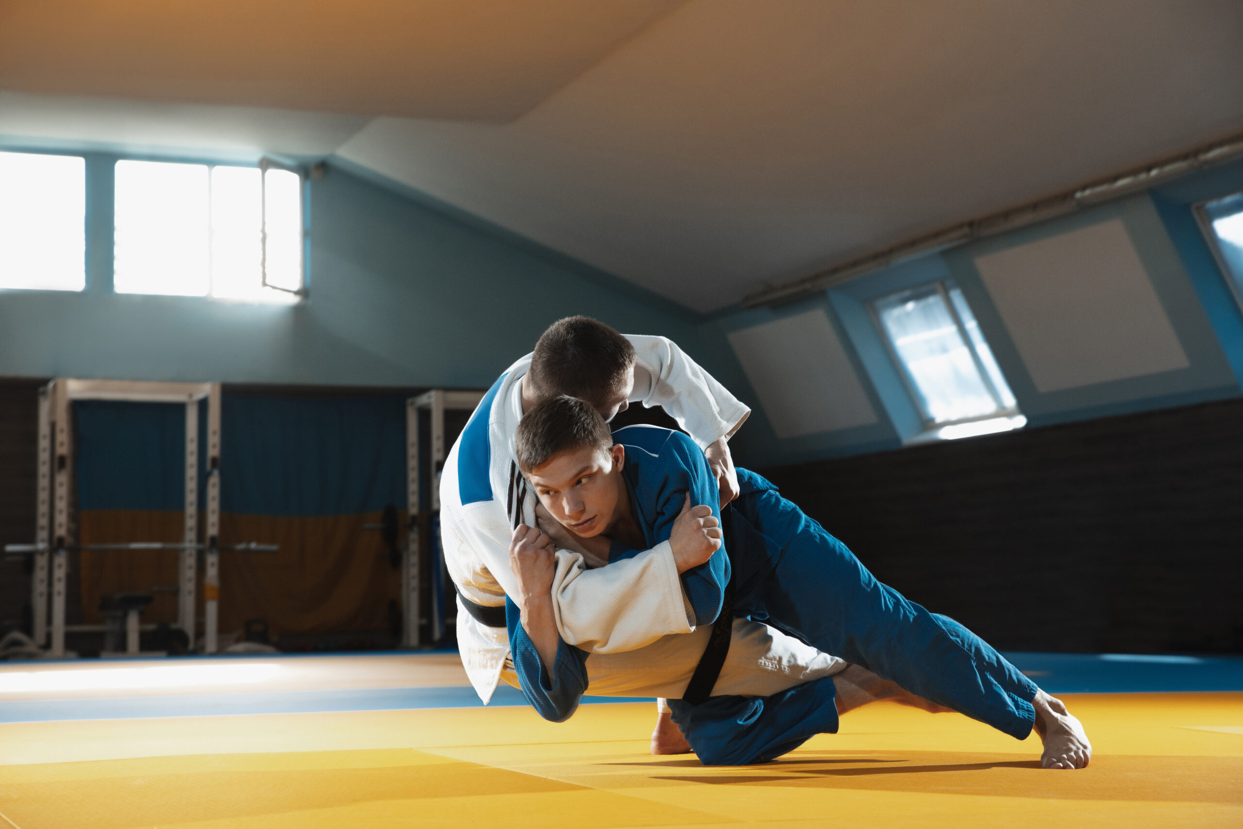 Judo fighters grappling on the mat